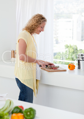 Attractive woman cooking at home