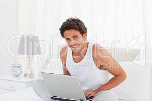 Man working on his laptop at home