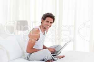 Man working on his laptop at home