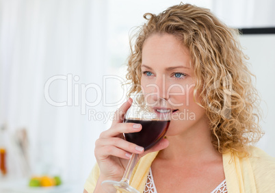 Pretty woman drinking some wine