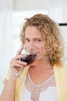 Pretty woman drinking some wine