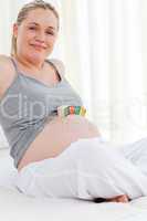 Pregnant woman with baby cubes on her belly