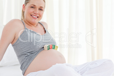 Pregnant woman with baby cubes on her belly