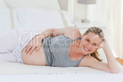 Beautiful woman with her hands on her belly