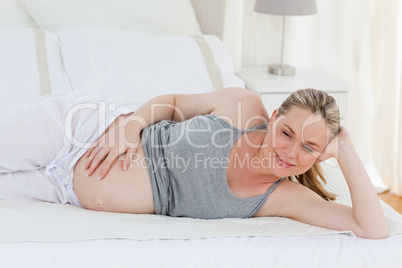 Beautiful woman with her hands on her belly