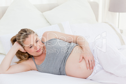 Beautiful woman with her hands on her belly