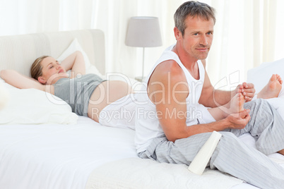 Future parents on their bed
