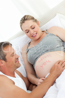 Future father touching his wife's belly