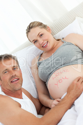 Future father touching his wife's belly