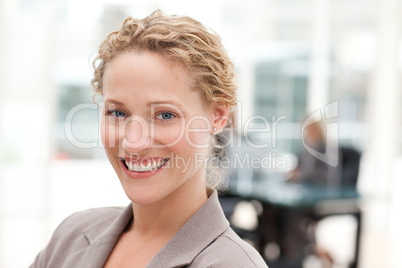 Smiling businesswoman in her office