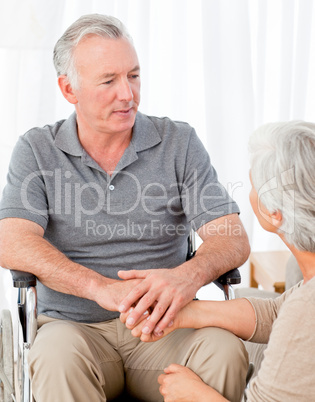 Woman with her husband in a wheelchair