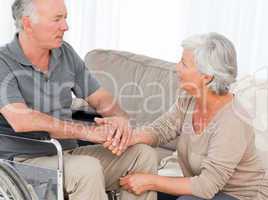 Woman with her husband in a wheelchair