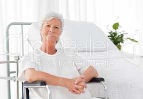 Senior woman in her wheelchair looking at the camera