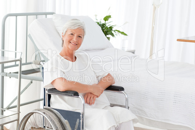 Senior woman in her wheelchair looking at the camera