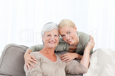 Wonderful nurse and her mature patient looking at the camera