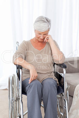 Thoughtful senior in her wheelchair