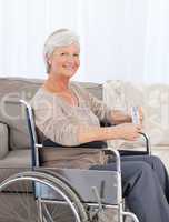 Woman looking at the camera in her wheelchair