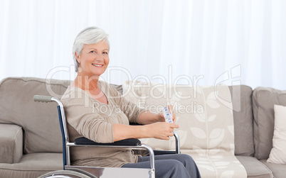 Woman looking at the camera in her wheelchair