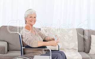 Woman looking at the camera in her wheelchair