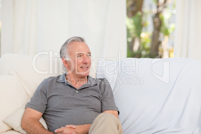 Senior sitting  in his sofa