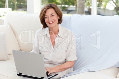 Senior working on her laptop