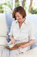 Retired woman reading her book