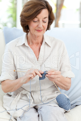 Woman knitting at home