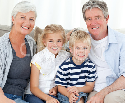 Happy family looking at the camera