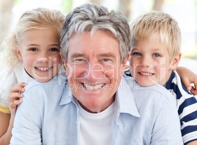 Joyfull little family looking at the camera