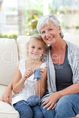Senior with her granddaughter looking at the camera
