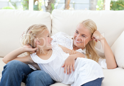 Beautiful woman lying down with her daughter