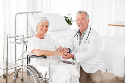 Patient with her doctor looking at the camera