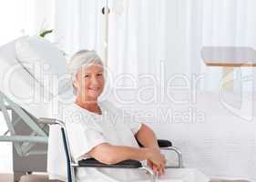 Senior woman in her wheelchair looking at the camera