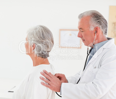 Doctor examining his patient Doctor examining his patient