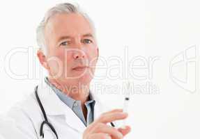 Senior doctor with syringes