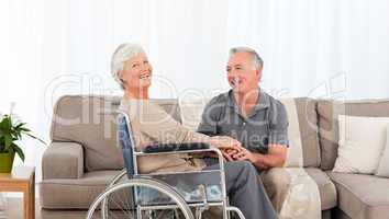 Man with his wife in a wheelchair