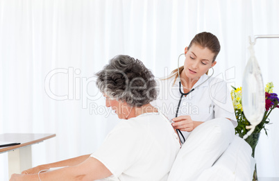 Nurse taking care of her patient