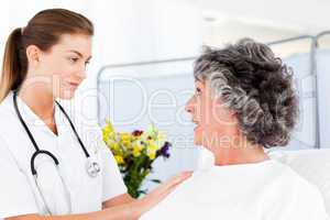 Mature woman talking with her nurse