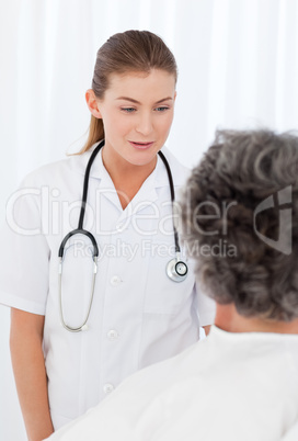 Mature woman talking with her nurse