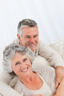 Mature woman hugging her husband