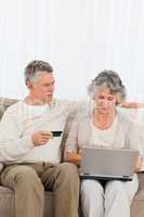 Seniors buying something on internet
