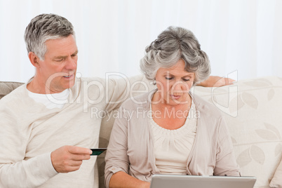 Seniors buying something on internet