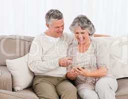 Couple looking at a photo  at home