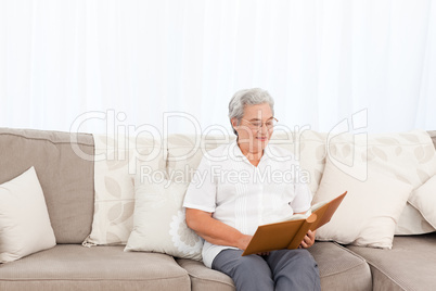 Woman looking at her photo album