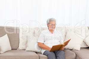 Woman looking at her photo album