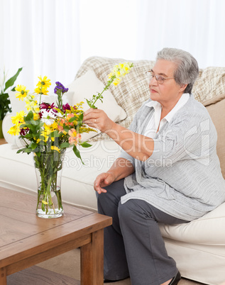 Senior woman with flowers