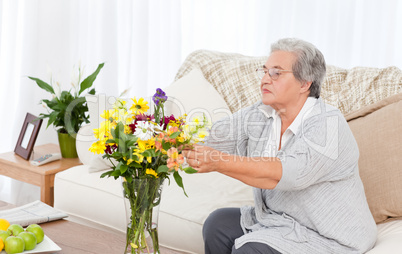 Senior woman with flowers