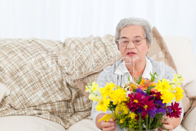 Senior woman with flowers