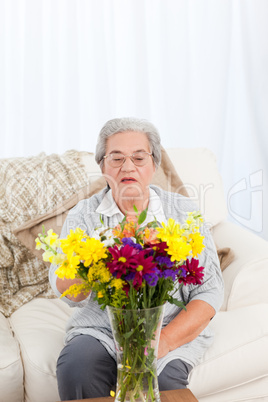 Senior woman with flowers