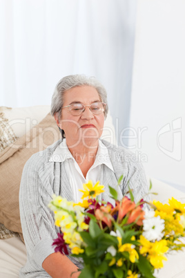 Senior woman with flowers